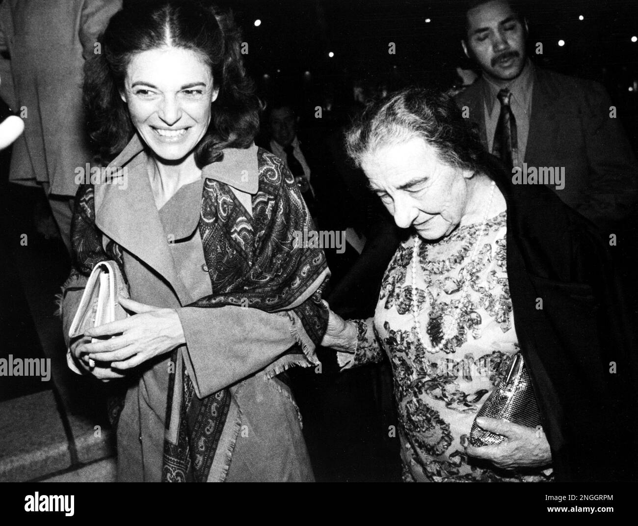 Golda Meir, former prime minister of Israel, holds the arm of actress ...