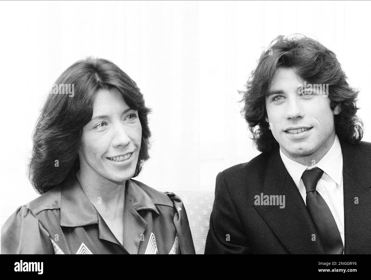 Costars Lily Tomlin, left, and John Travolta are shown at a news conference to promote their