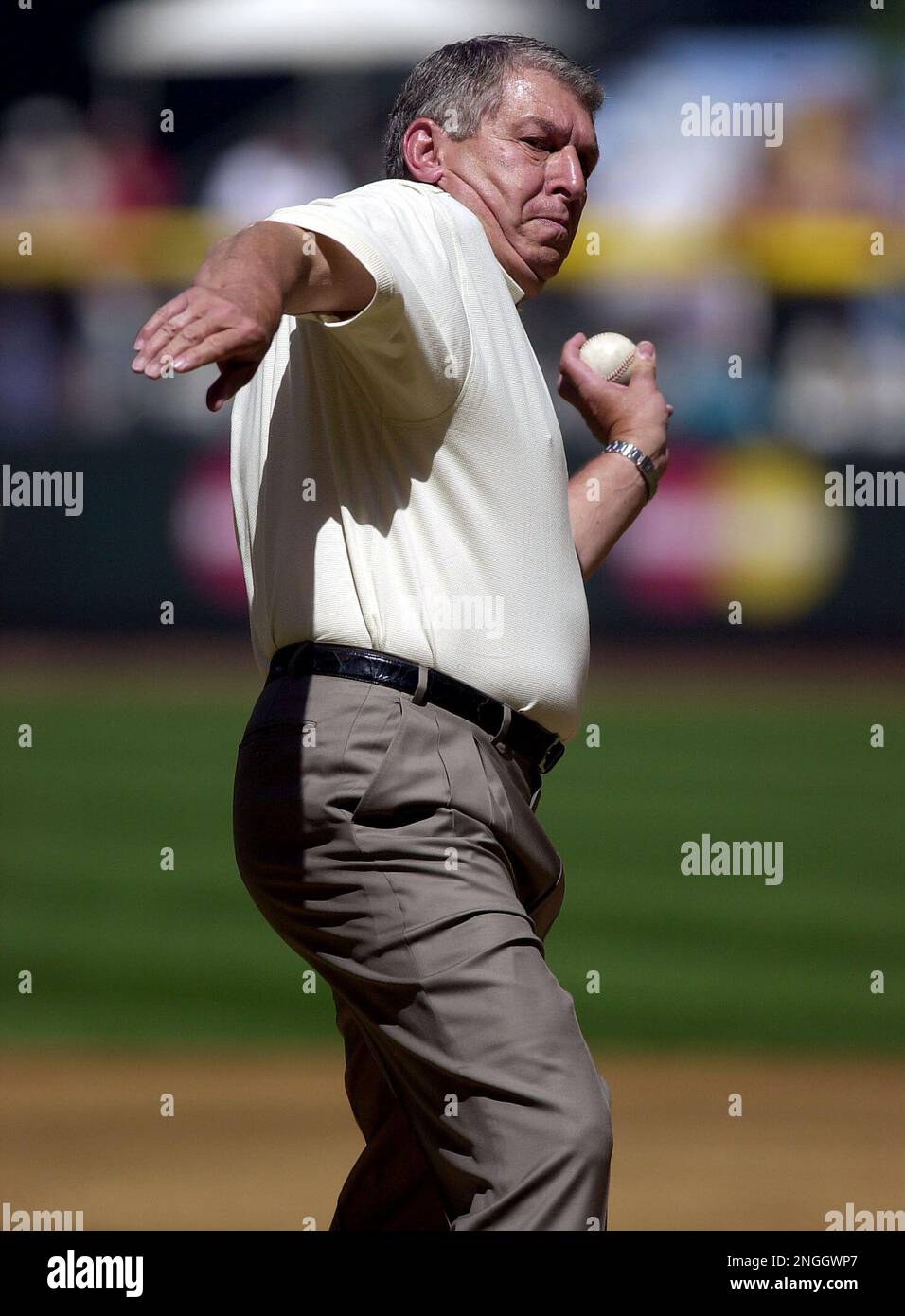 Arizona Diamondbacks owner Jerry Colangelo, left, presents pitcher Randy  Johnson with his third consecutive Cy Young award prior to the Diamondbacks  match-up against the San Diego Padres Wednesday, April 3, 2002 at