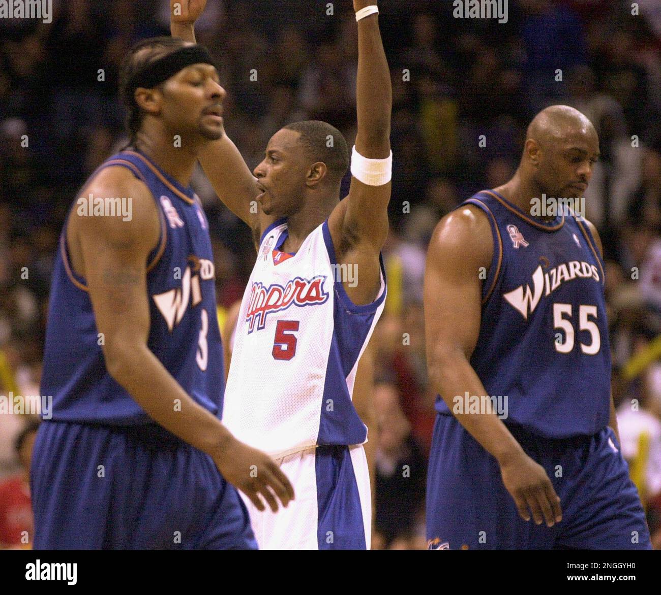 Los Angeles Clippers' Jeff McInnis (5) celebrates his game-winning basket  at the buzzer as Phoenix Suns' Stephon Marbury, right, watches Friday,  March 29, 2002, in Phoenix. The Clippers won 96-94. (AP Photo/Matt