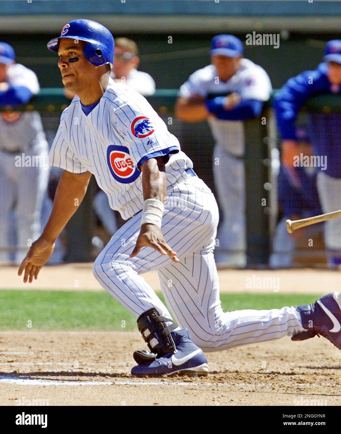 Chicago Cubs' Moises Alou follows the ball before grounding out at first  during the first inning of their spring game against the San Francisco  Giants in Mesa, Ariz., Monday March 11, 2002.(AP