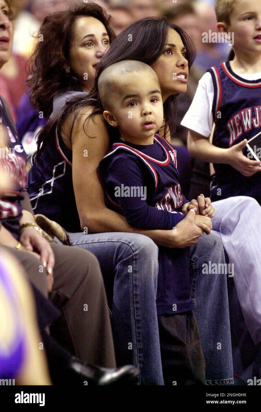 Joumana Kidd, wife of New Jersey Nets' Jason Kidd, watches the final  seconds of the Nets-Phoenix Suns game with their son, T.J., Wednesday,  March 6, 2002, at America West Arena in Phoenix.