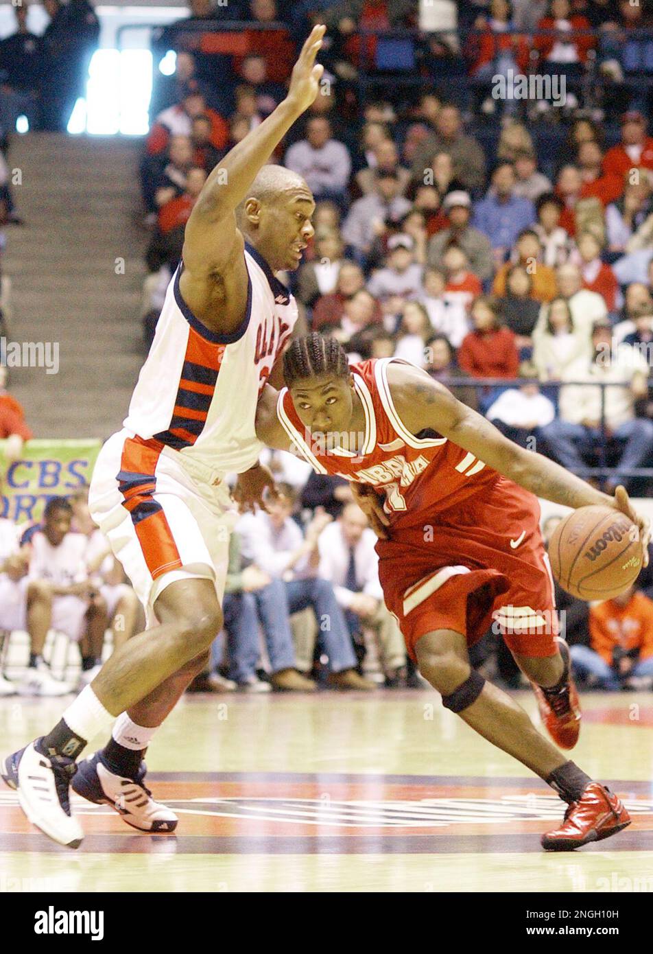 Alabama guard Rod Grizzard dribbles past Mississippi forward Justin