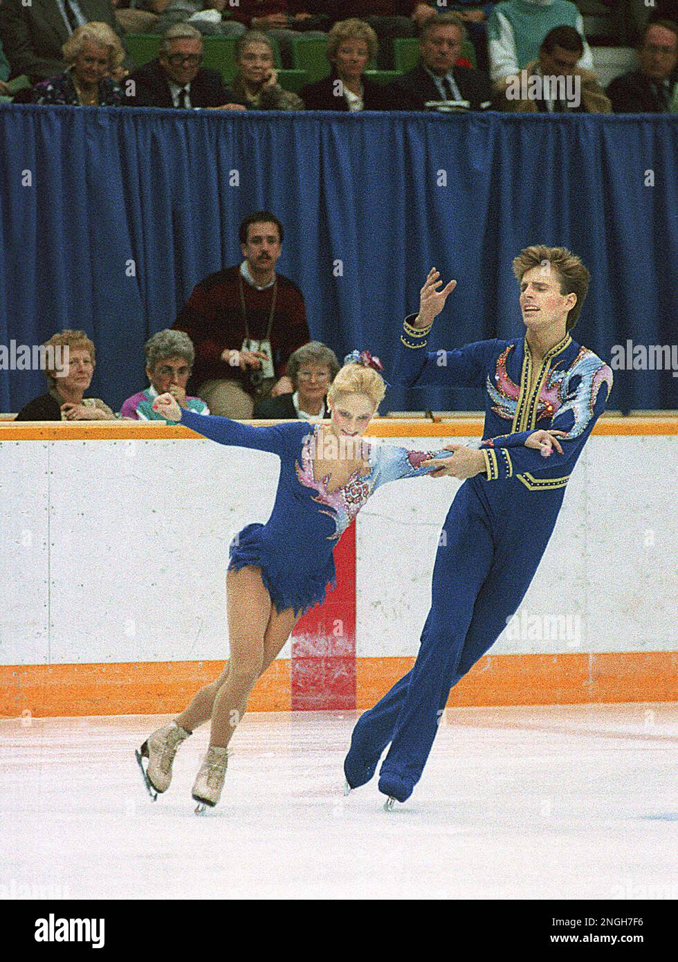 Peter Oppegard of Knoxville, Tenn., holds Jill Watson of Bloomington, Ind., as they skate to the music in the Olympic night pairs figure skating at Calgary, Canada. The pair gave the United States its first medal of the XV Winter Olympics by winning the bronze medals. (AP Photo/Massimo Sambucetti) Stock Photo
