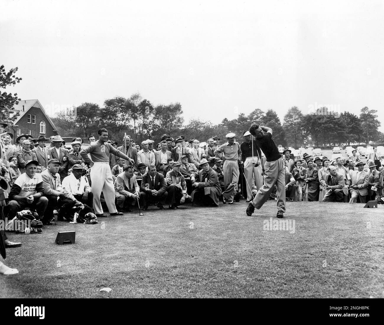 Jack Burke of Houston, Texas, drives off the first tee in opening round of the 15,000 round