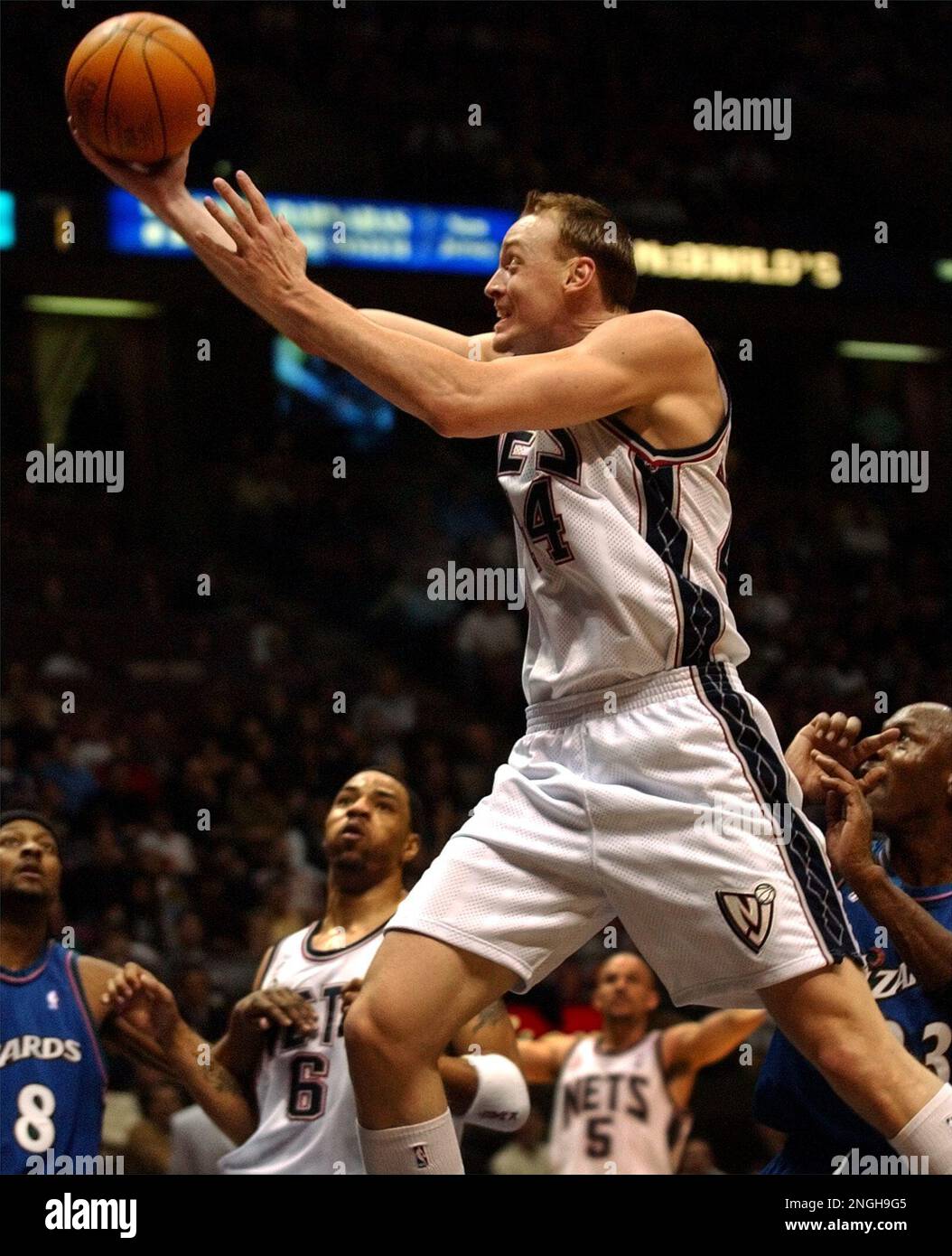 New Jersey Nets' Keith Van Horn goes up with a shot against the defense