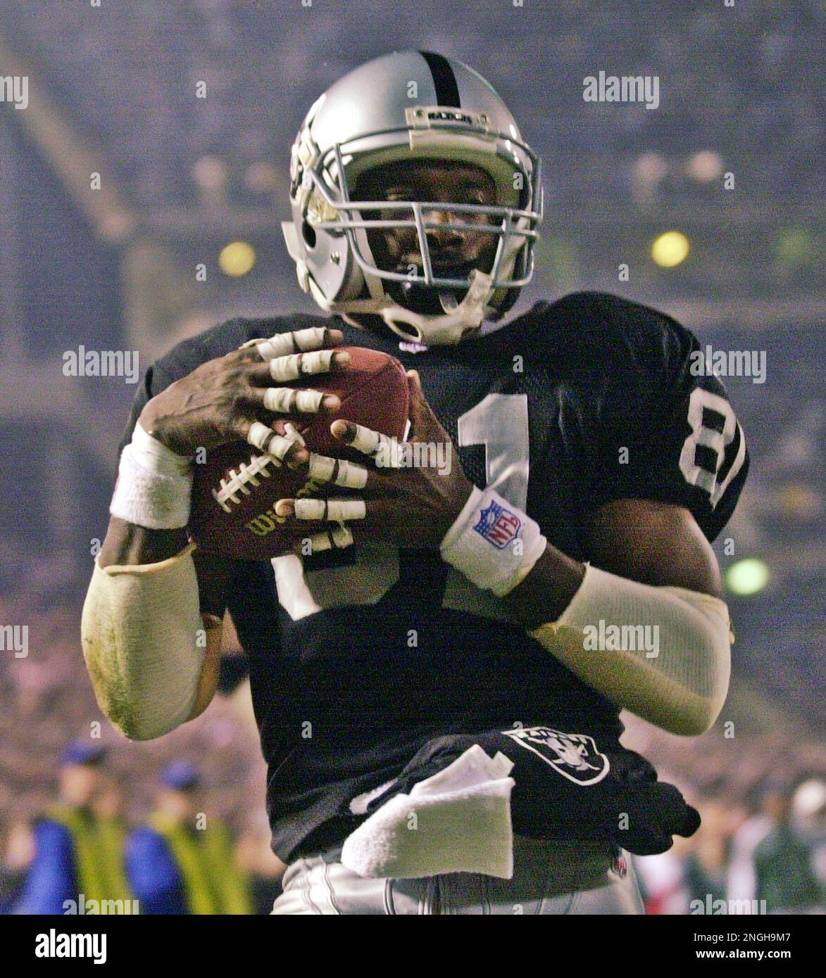 Oakland Raiders' Tim Brown carries the ball in for a touchdown in the ...
