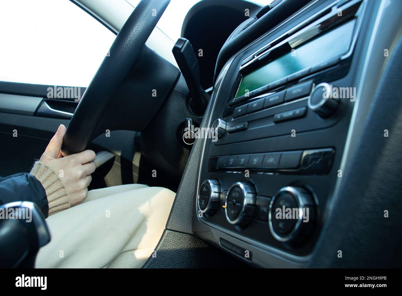 a girl driving her car rides a robot, a man in a car Stock Photo Alamy
