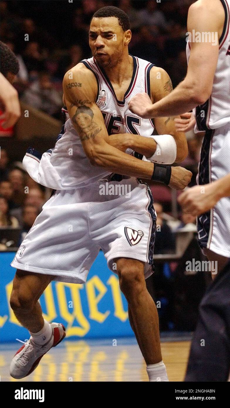 New Jersey Nets' Kenyon Martin follows through after swinging at Orlando  Magic's Tracy McGrady during the fourth quarter Friday night, Jan. 4, 2002,  in East Rutherford, N.J. (AP Photo/Bill Kostroun Stock Photo -