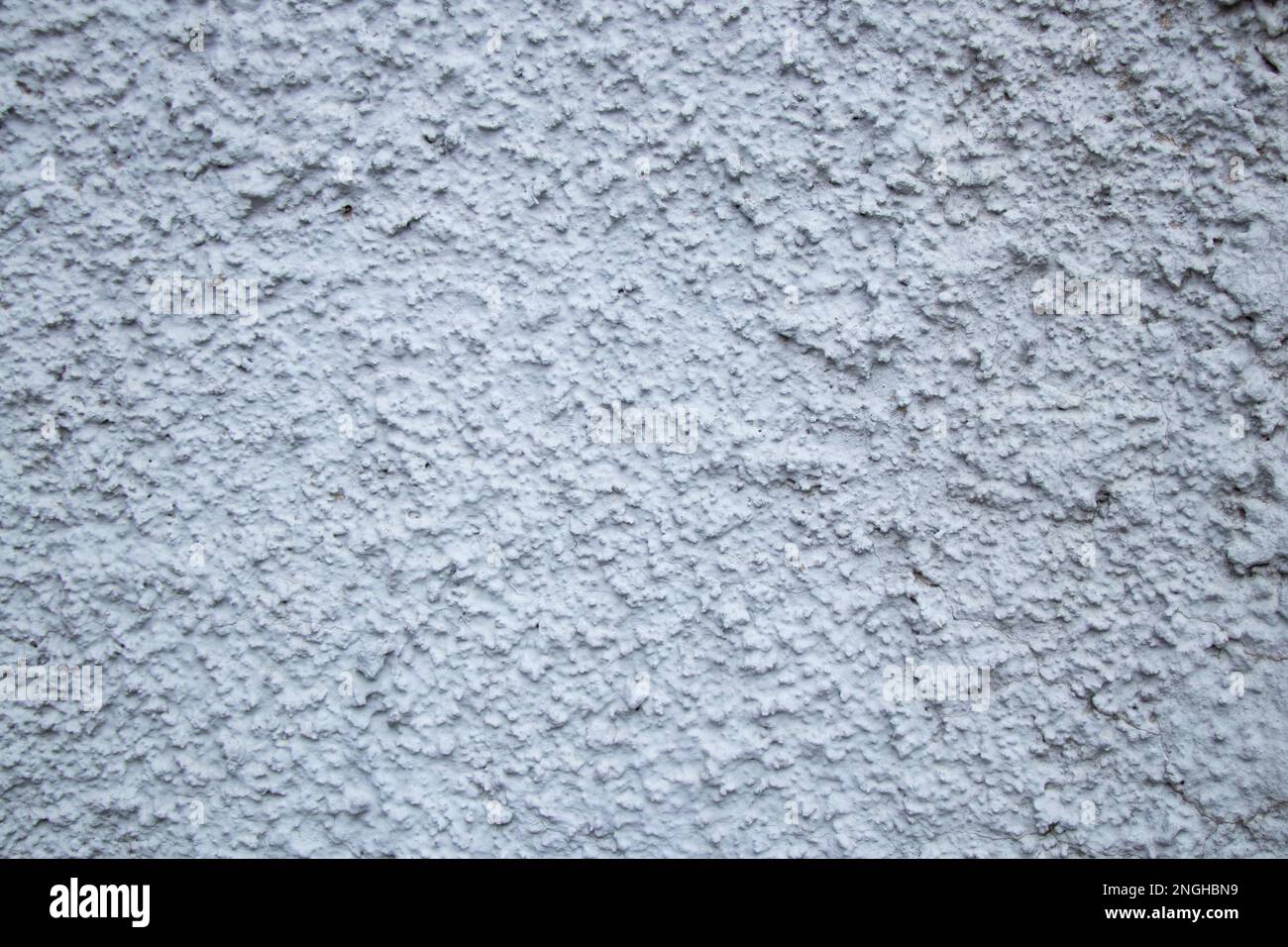 stone wall of a house as a background Stock Photo