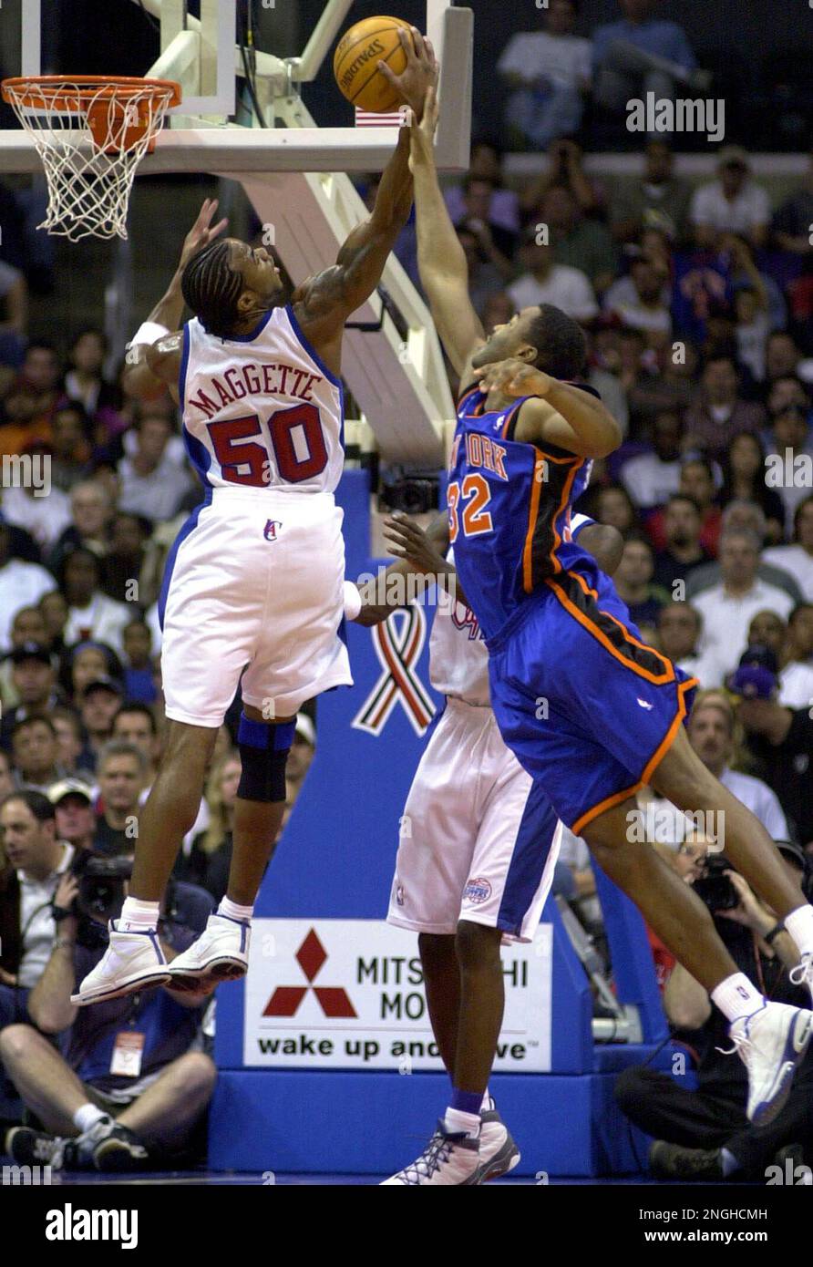 Los Angeles Clippers' Cory Maggette, left, pulls in a rebound over New York  Knicks' Othella Harrington during the first half in Los Angeles, Sunday,  Nov 18, 2001. The Clippers won 99-86. (AP
