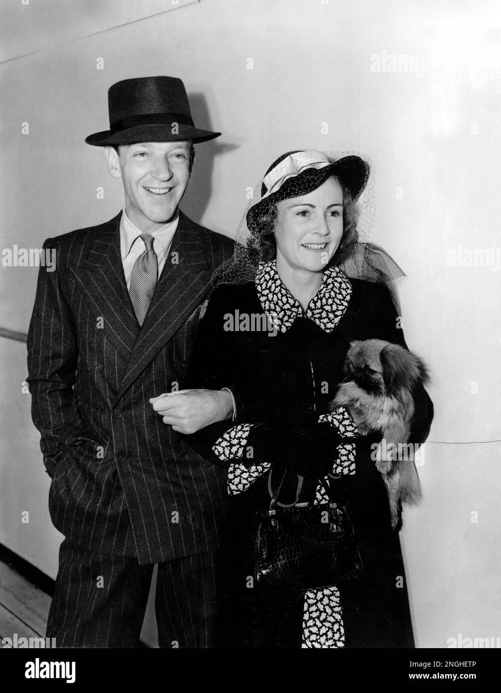 Actor-dancer Fred Astaire and his wife, Phyllis, arrive on the liner Queen Mary in New York City on June 5, 1939. The couple spent six weeks in Europe where they were visiting Astaire's sister in Lismore, Ireland. (AP Photo) Stock Photo