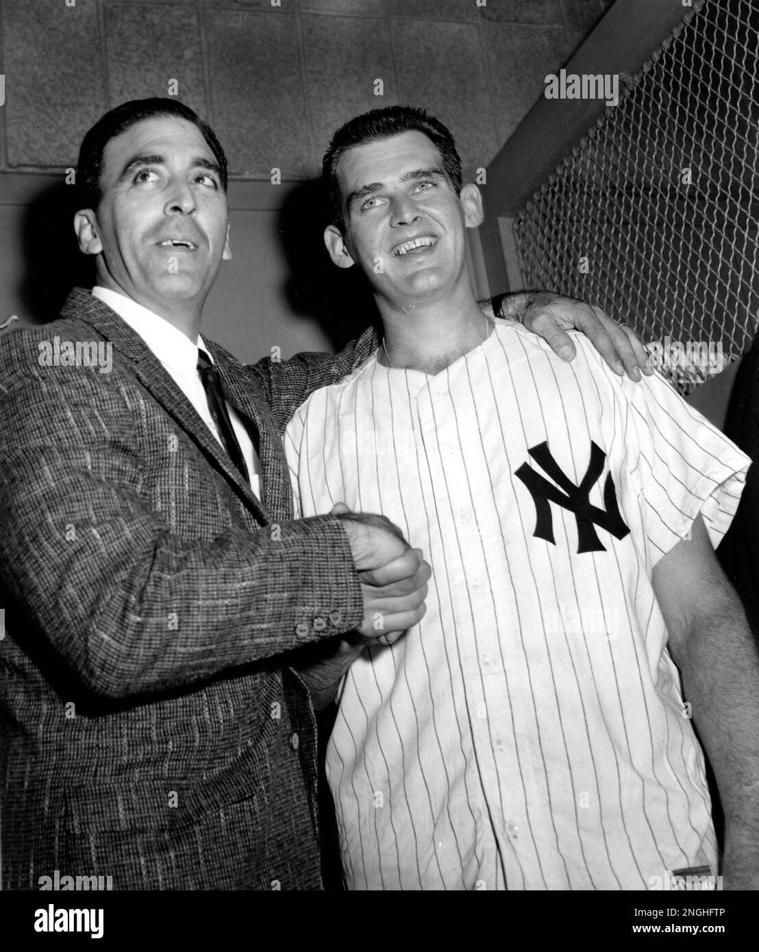 Brooklyn Dodgers pitcher Sal Maglie congratulates New York Yankees pitcher Don Larsen on his