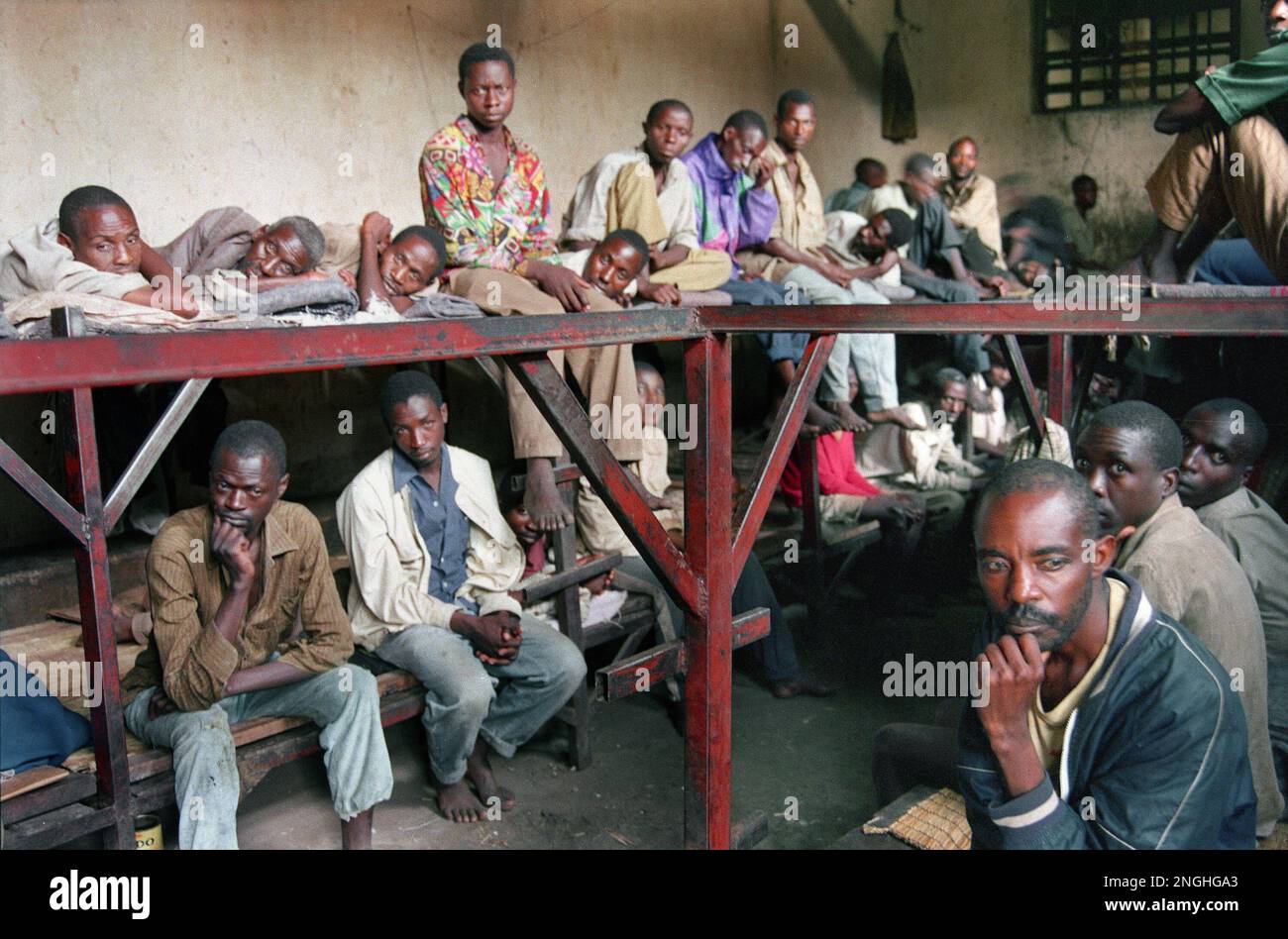 Inmates accused of war crimes sit in a prison in Kibungo, Rwanda ...
