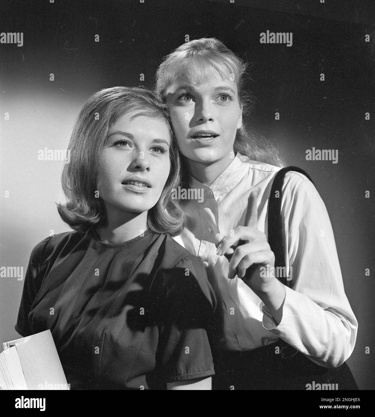Mia Farrow, right, and Gyl Roland, 19, pose during a break in the filming of their first movie "Peyton Place" in Hollywood, Ca., on Oct. 9, 1963. (AP Photo) Stock Photo