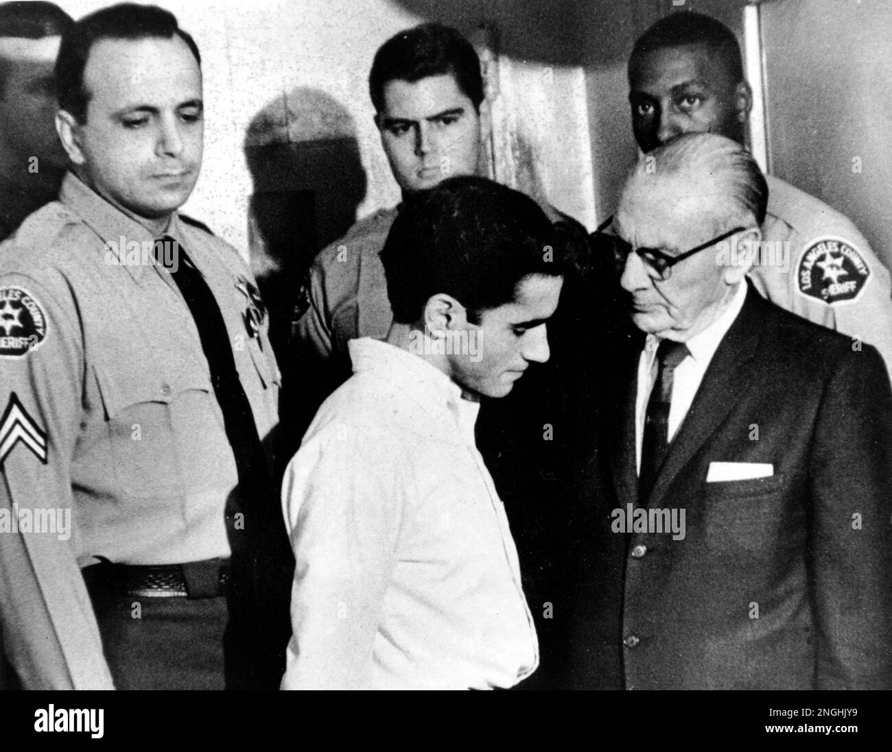 three-los-angeles-county-deputy-sheriffs-stand-by-as-sirhan-bishara