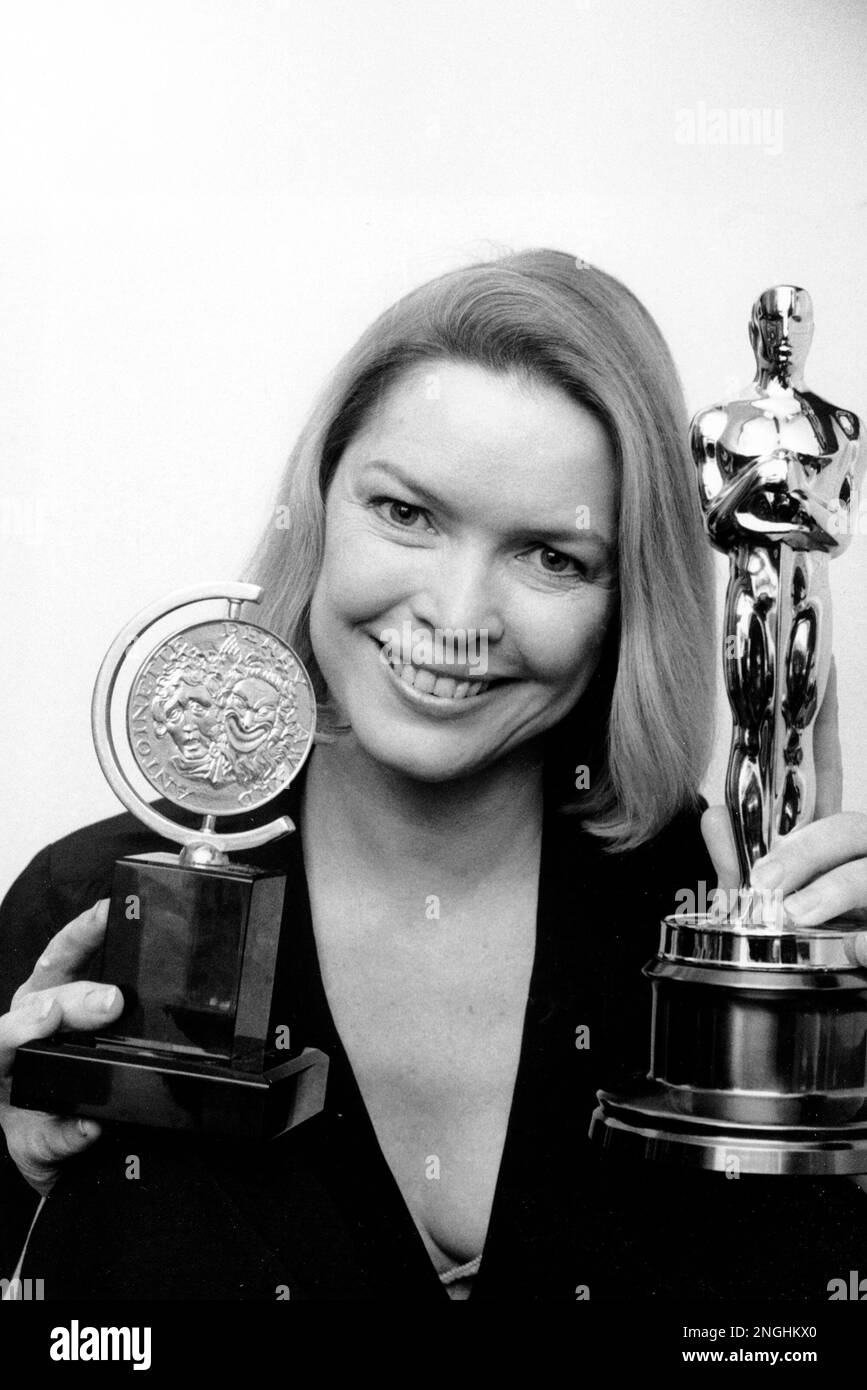 Ellen burstyn holds her tony award and oscar statuette backstage at the