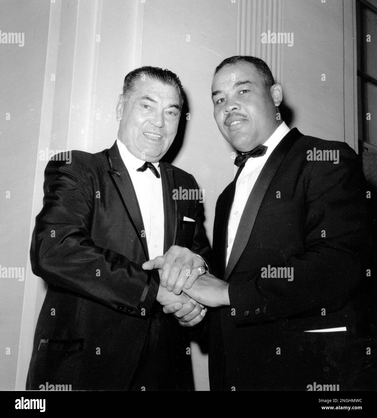Former heavyweight champions Jack Dempsey, left, and Joe Louis pose ...