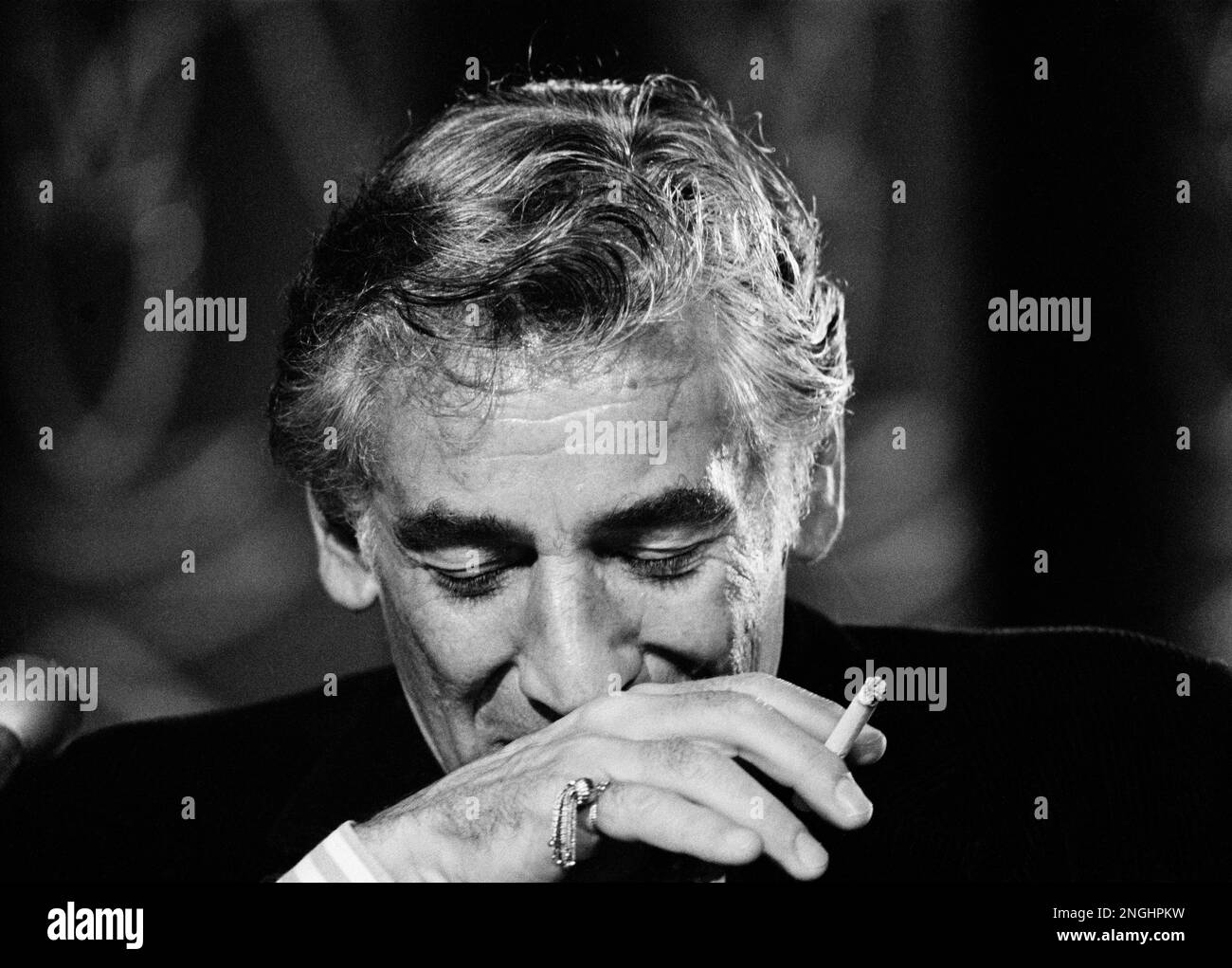 With his ever-present cigarette in hand, Leonard Bernstein pauses during a  news conference in Washington D.C. on July 26, 1971. He is discussing the  work is preparing for the September 8 opening