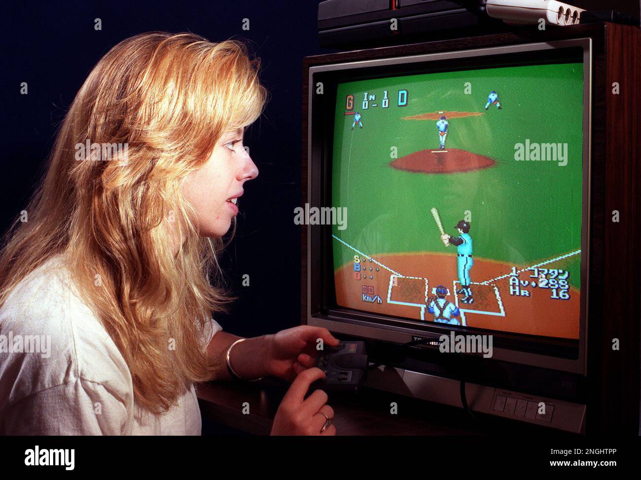 Gina Hartwig checks out the new TurboGrafix-16 system made by NEC Home  Electronics Inc., in New York City in July, 1989. (AP PhotoRay Stubblebine  Stock Photo - Alamy