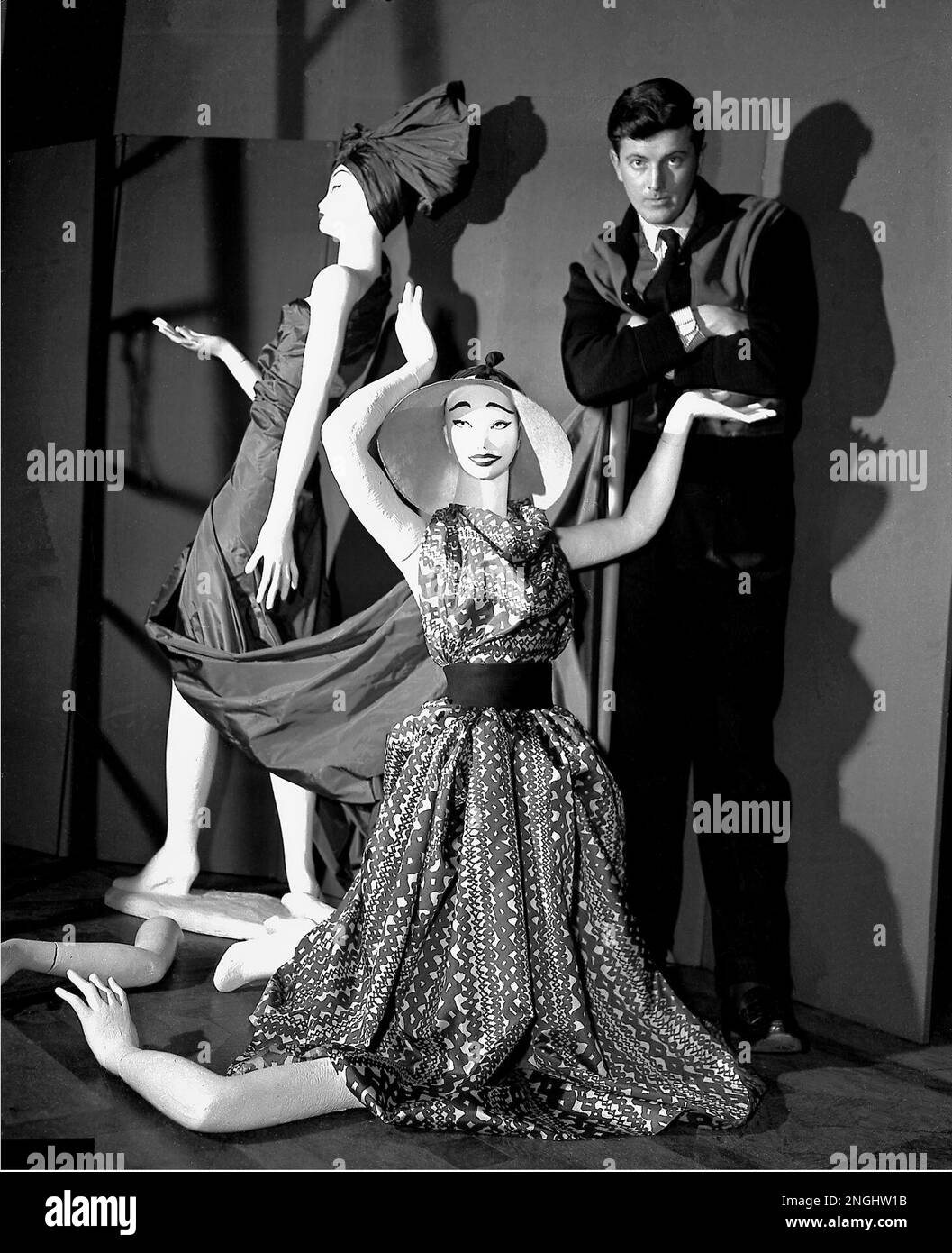 Fashion designer Hubert de Givenchy poses with mannequins in his