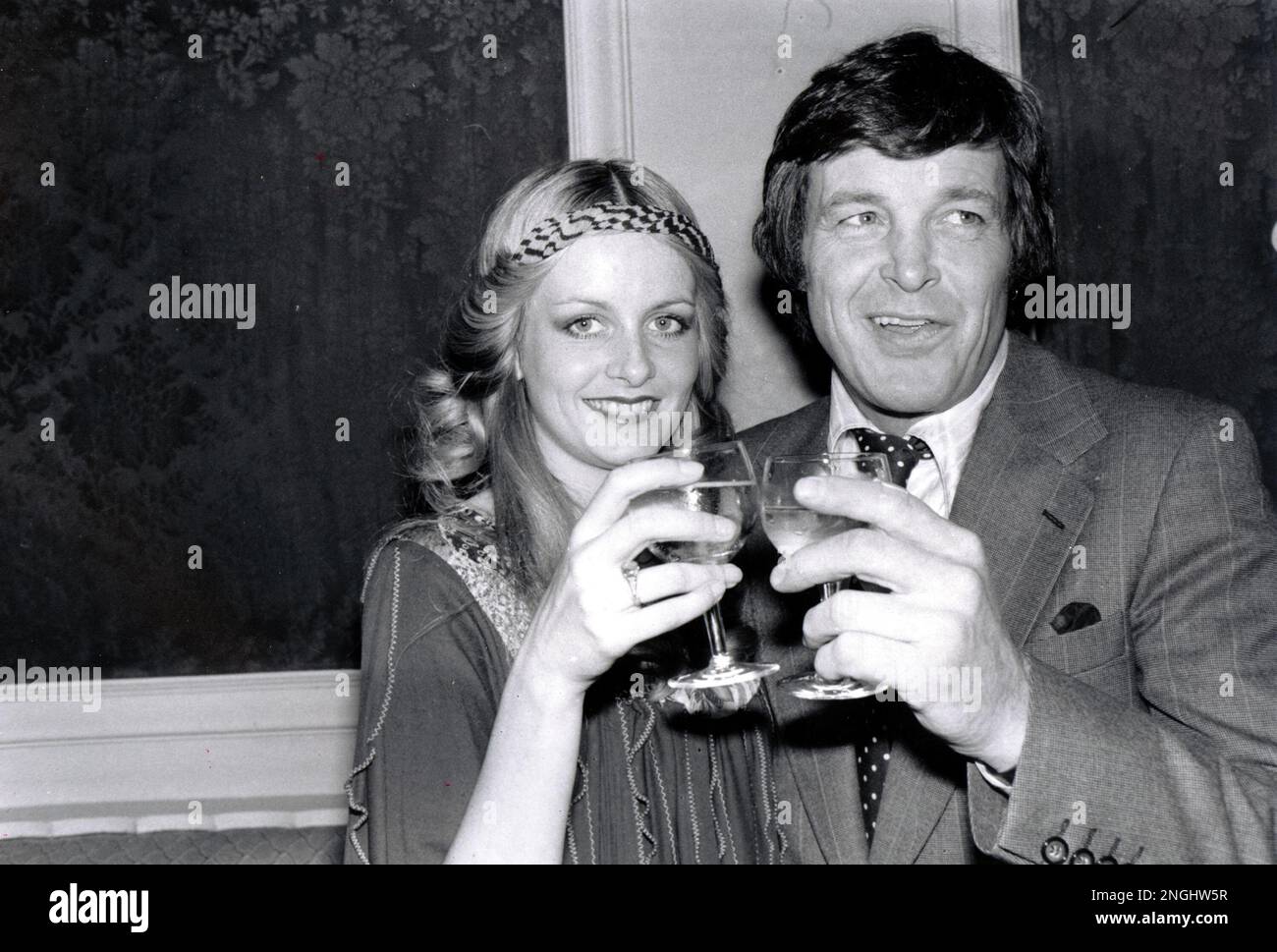 Film actress and singer Twiggy, 26, is shown with her partner and