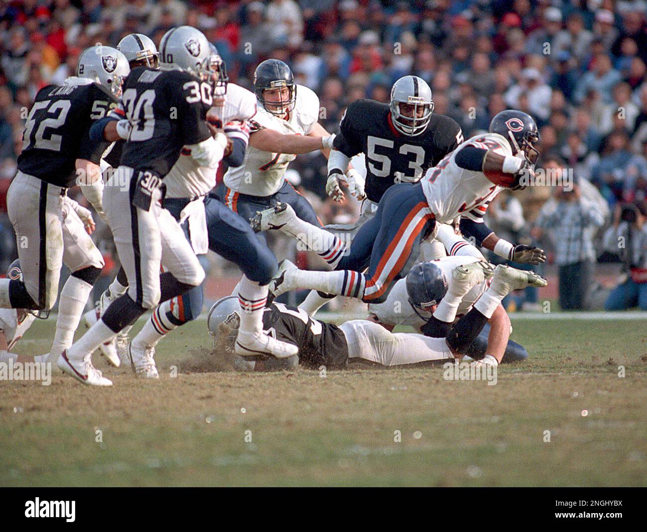 Football athlete Walter Payton, of the Chicago Bears, dives for yardage