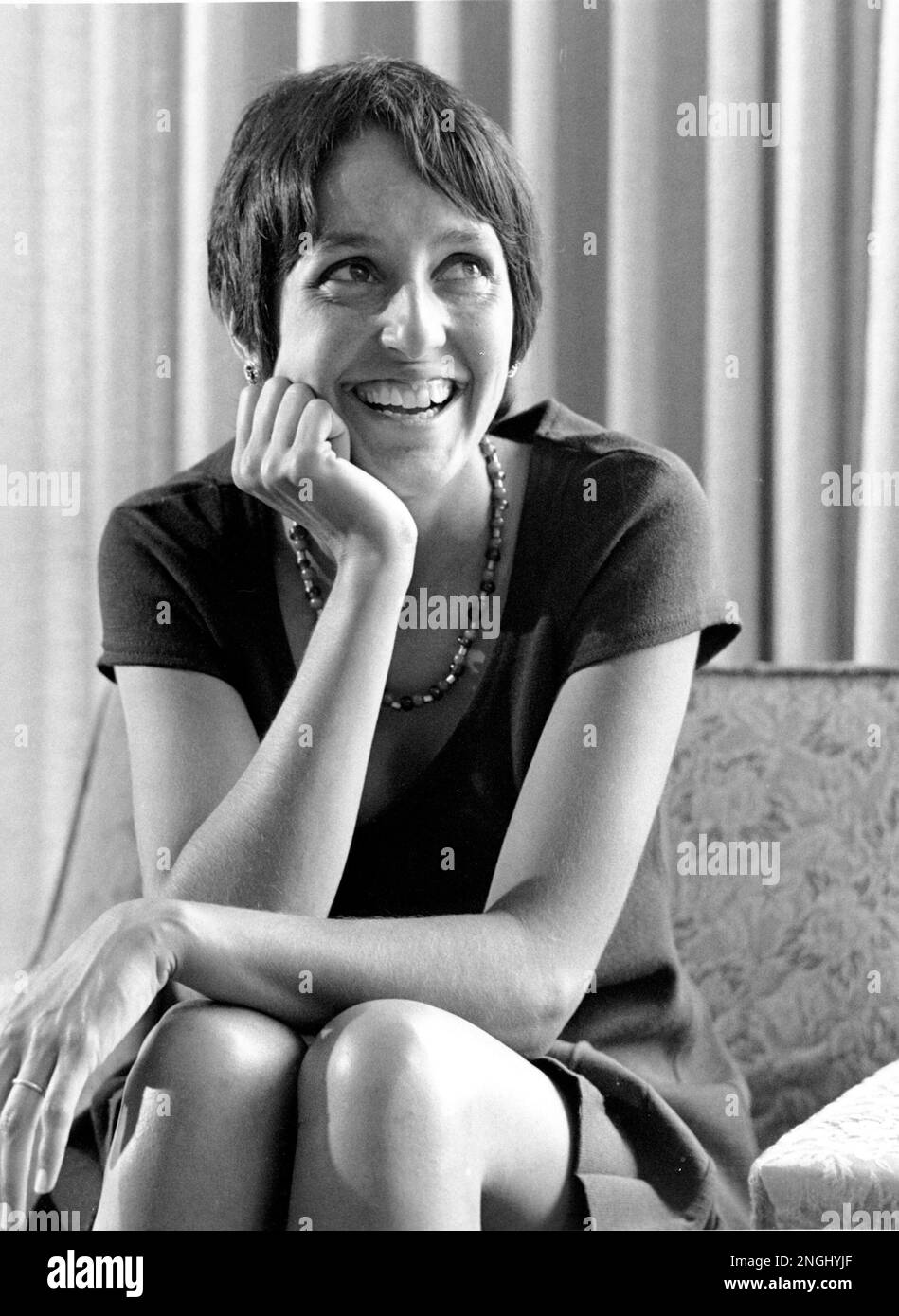 Folk singer Joan Baez laughs during a press conference on June 27