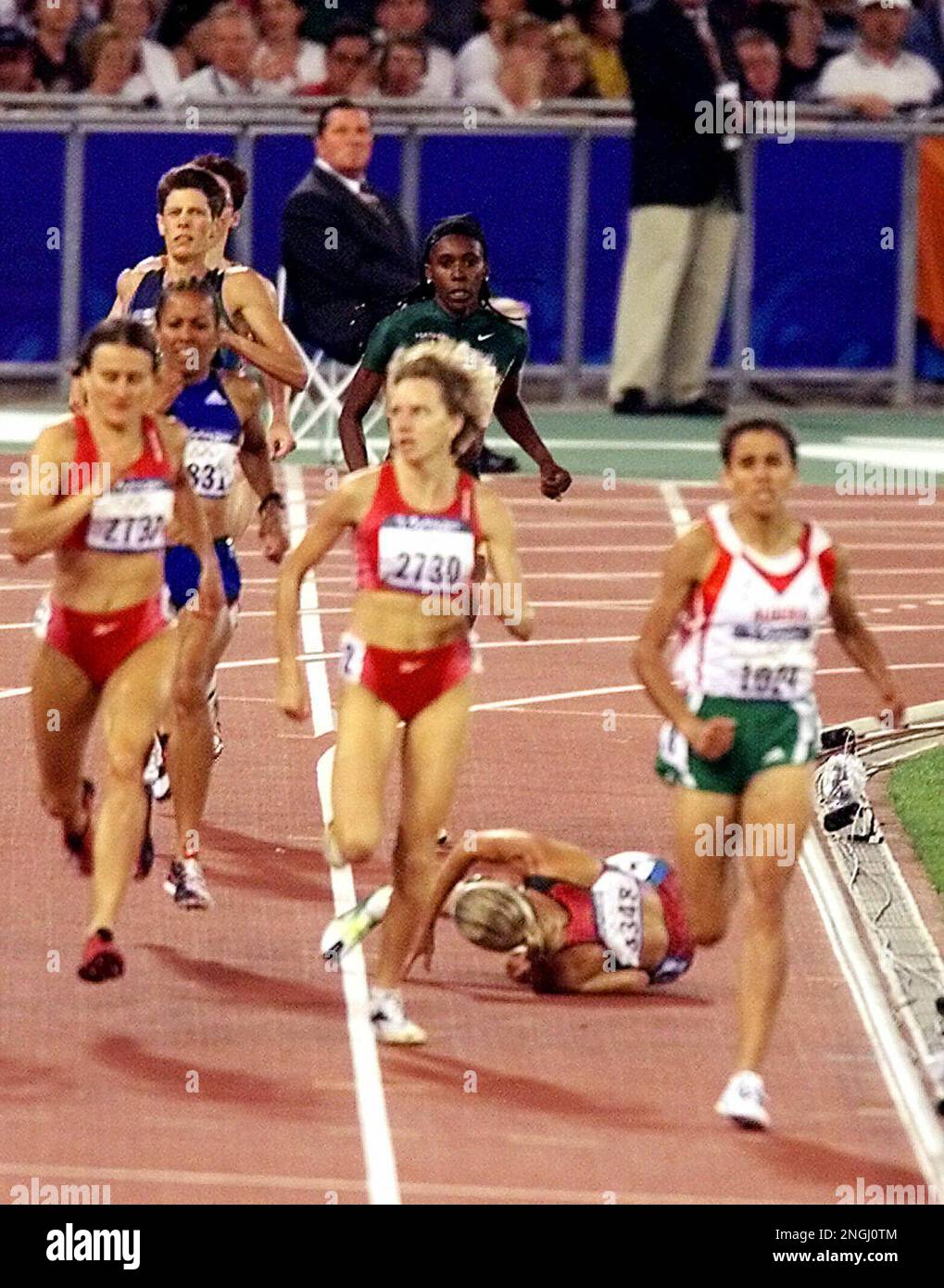 U.S. runner Suzy Favor Hamilton falls during the women's 1,500 meter ...