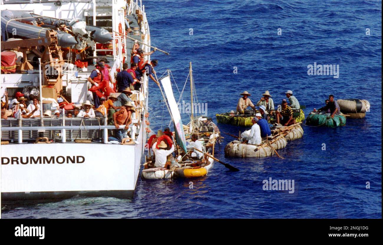 A group of cuban rafters float next to the 110-foot U.S. Coast Guard ...