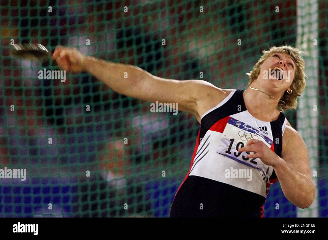 German discus thrower Ilke Wyludda throws during the women's discus