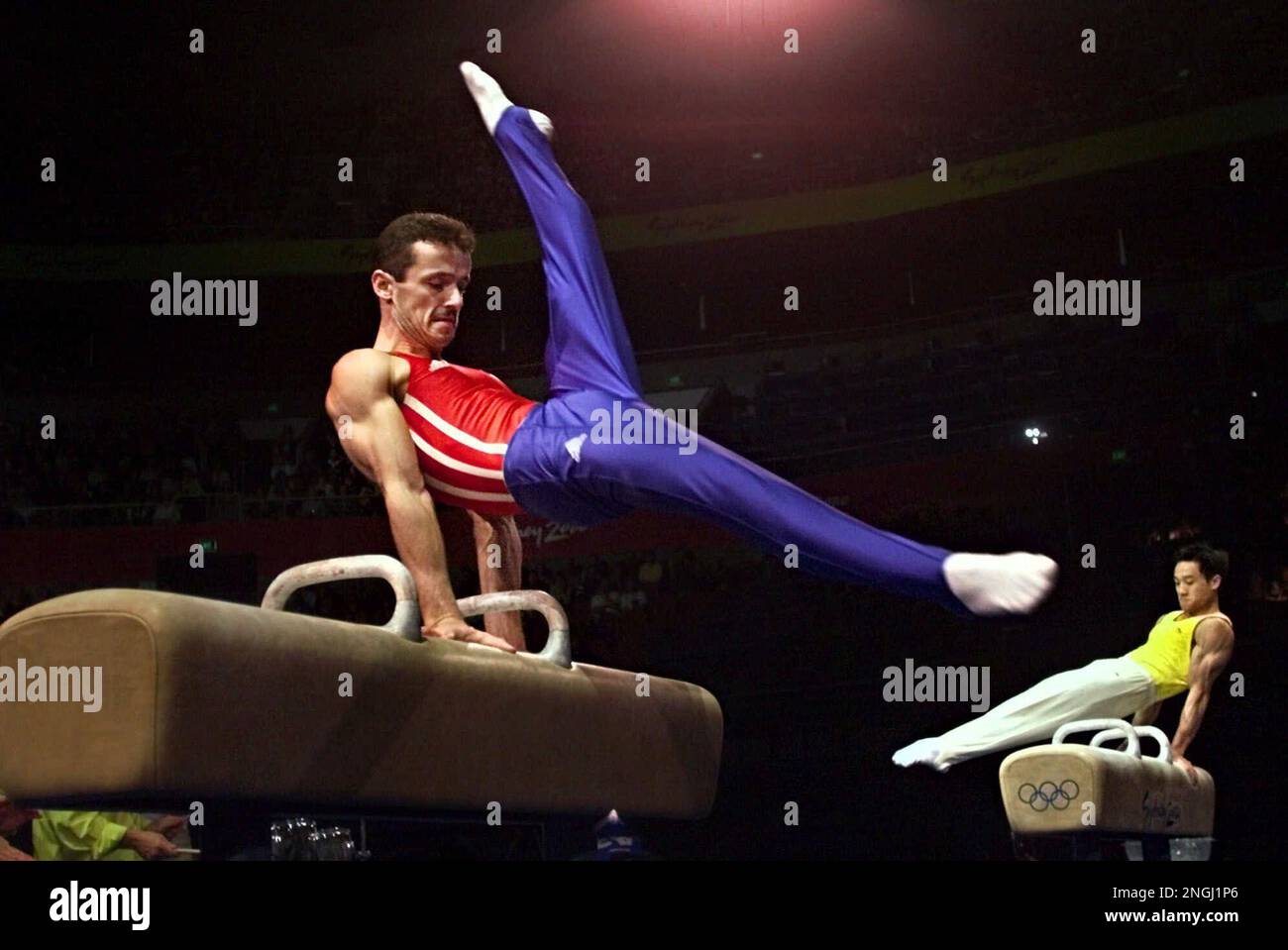 Pommel horse gold medalist Marius Urzica, left, from Romania and Wei