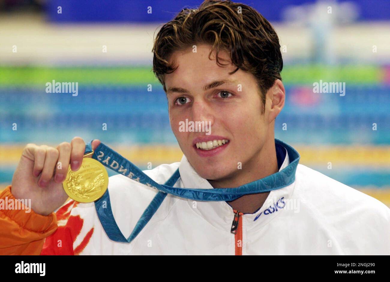 dutch-swimmer-pieter-van-den-hoogenband-holds-up-his-gold-medal-for-the