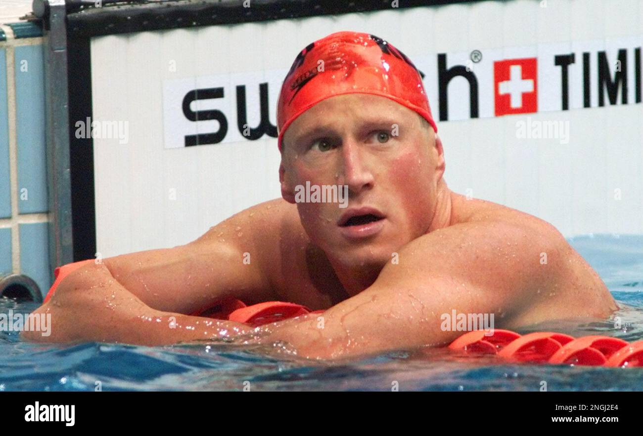 German swimmer Christian Keller rests after competing in a heat of the