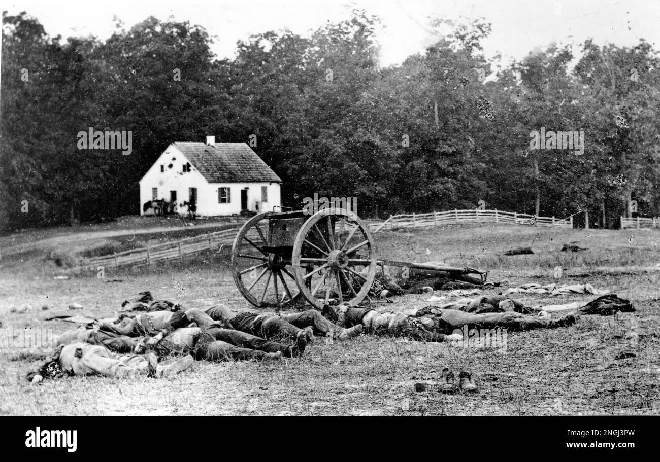 Bodies Of Fallen Troops And A Crashed Gun Lie On The Field After The 