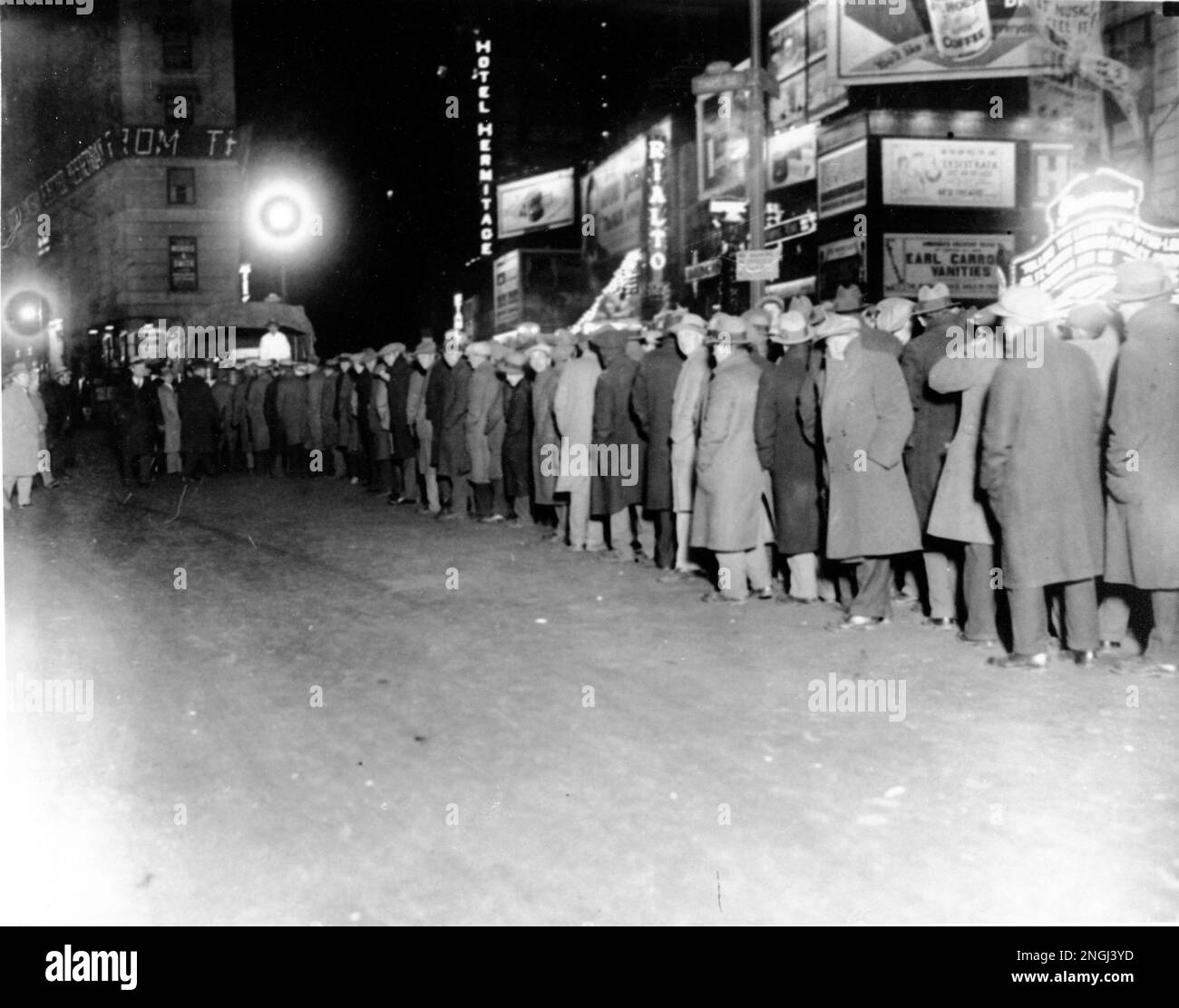 People line in Times Square and 43rd Street to recieve sandwiches and a
