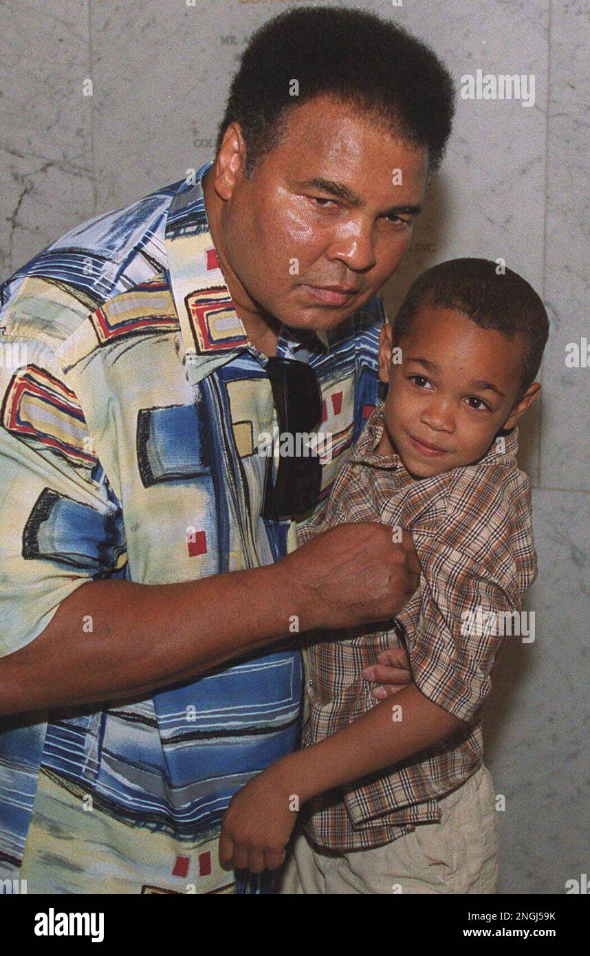 Muhammad Ali picks up his grandson Michael Alford, 5, before the start of  the premier showing of Twice Born, in New York Wednesday, Aug. 9, 2000.  The NBC documentary offers a look