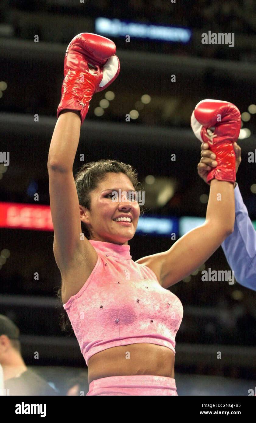 Mia Rosales St. John, of Calabasas, Calif., raises her gloves in