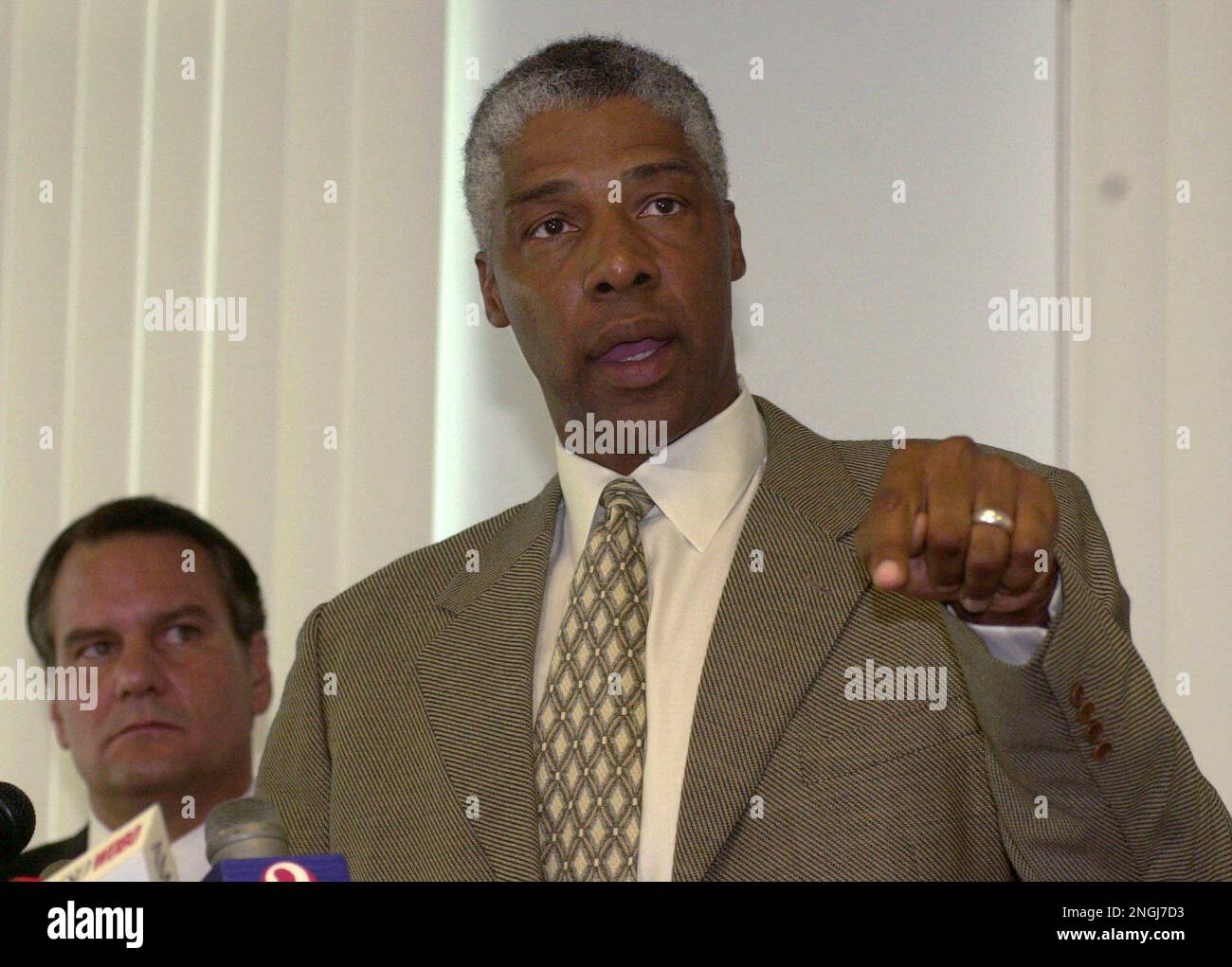 Former basketball star and now Executive Vice President of the Orlando  Magic Julius Erving answers questions as Seminole County Sheriff Don  Eslinger, left, looks on Tuesday, June 13, 2000, at the Seminole