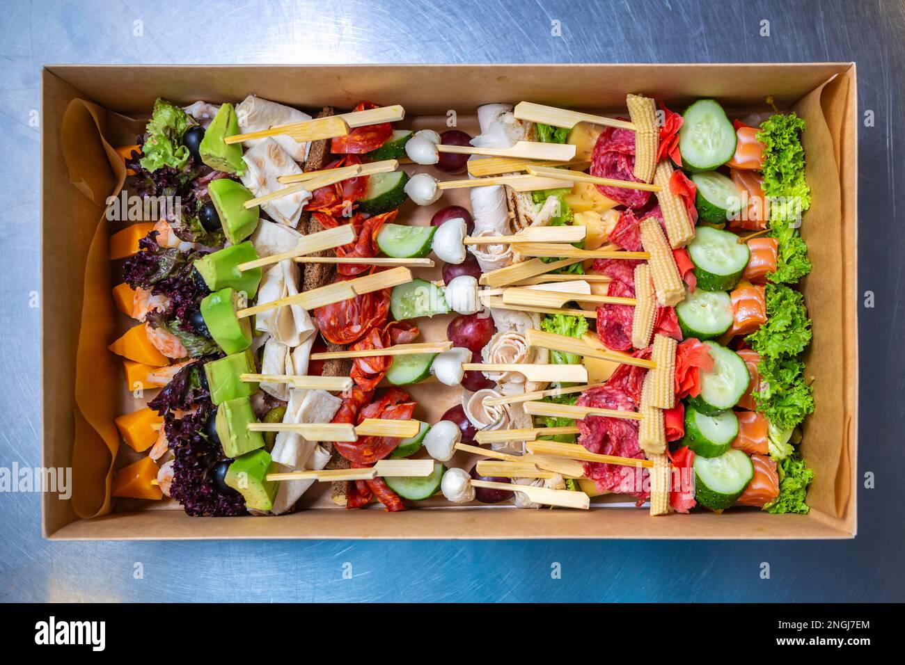 Big box with snacks on sticks delivered for food catering service on venue. Delicious  natural appetizers for party. Shot in flat lay style direct Stock Photo -  Alamy