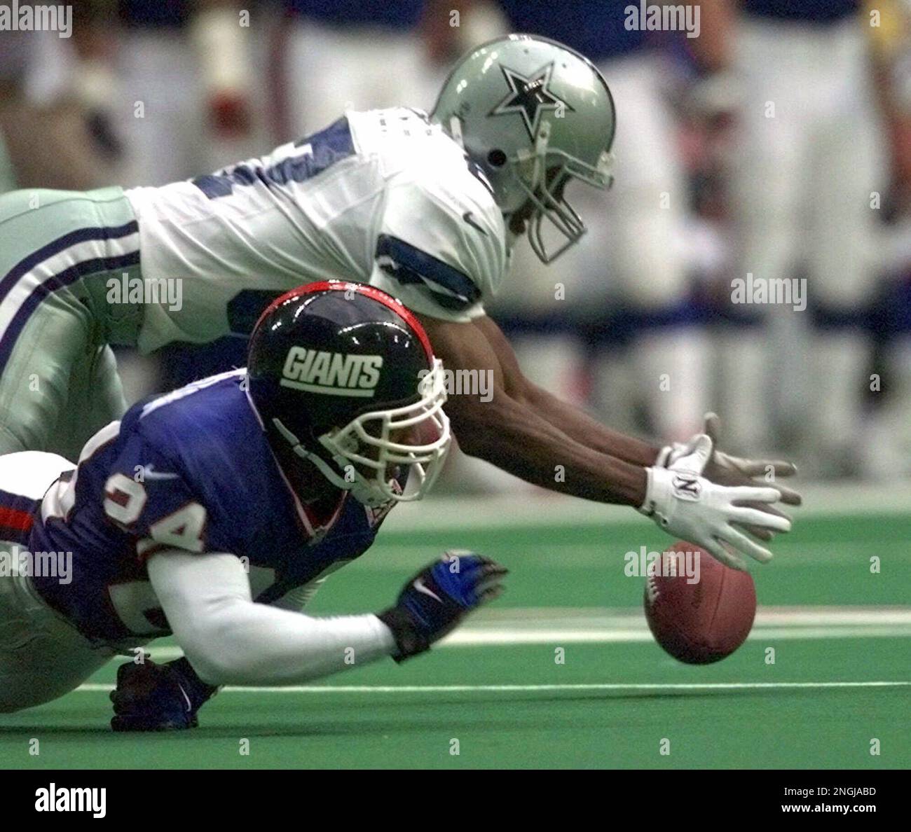 Dallas Cowboys tackle Solomon Page (77) reaches to recover a fumbled ball  over New York Giants