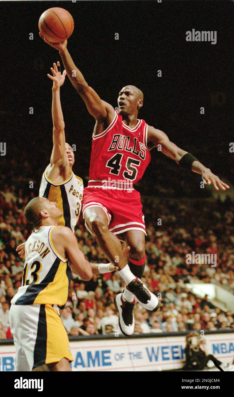 Chicago Bulls guard Michael Jordan flies to the hoop over the Indiana Pacers Reggie Miller and Mark Jackson 13 March 19 1995 in Indianapolis Ind. Nicknamed Air Jordan for his superb athleticism