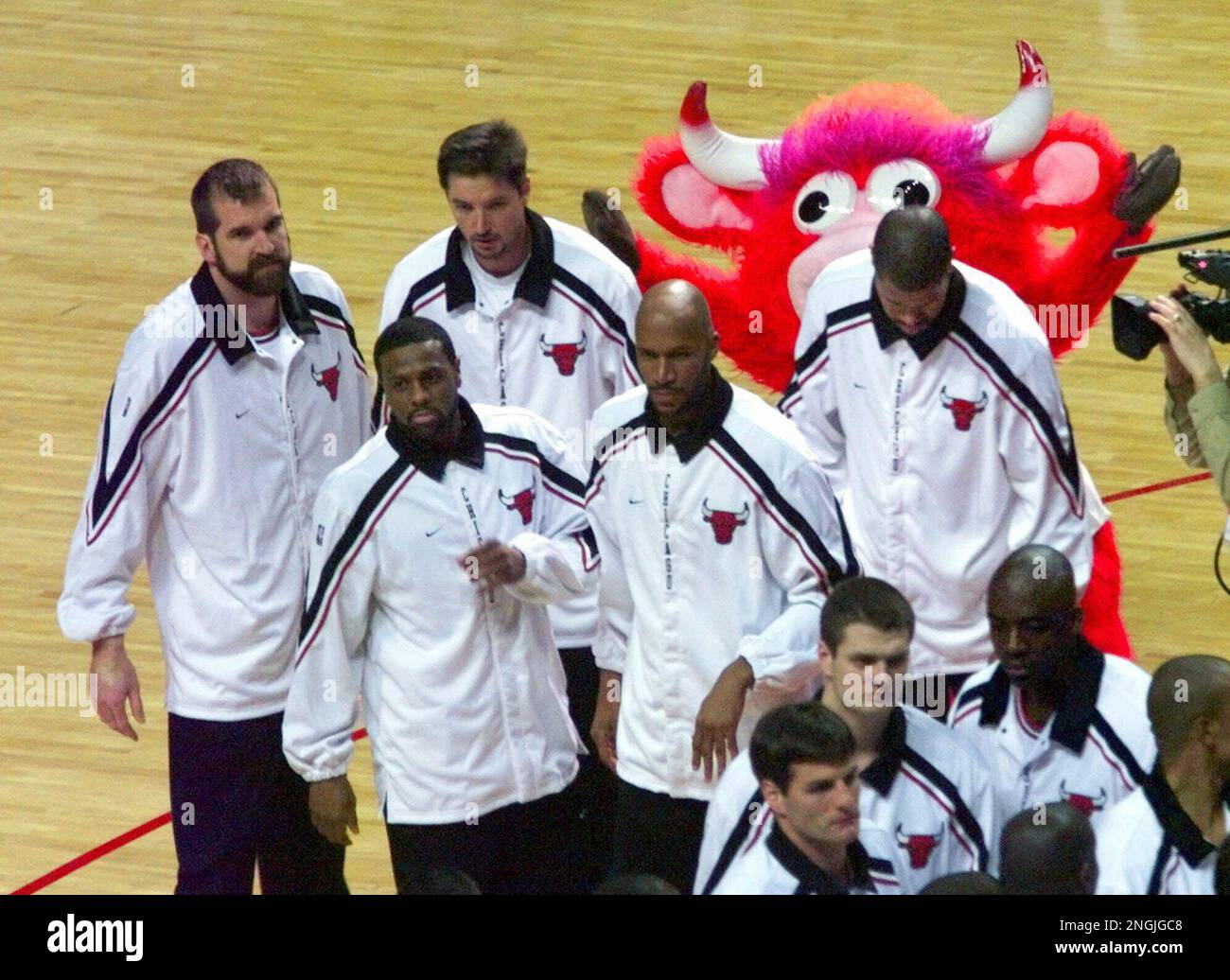 Chicago Bulls' Dennis Rodman, with a new red hair color, shouts