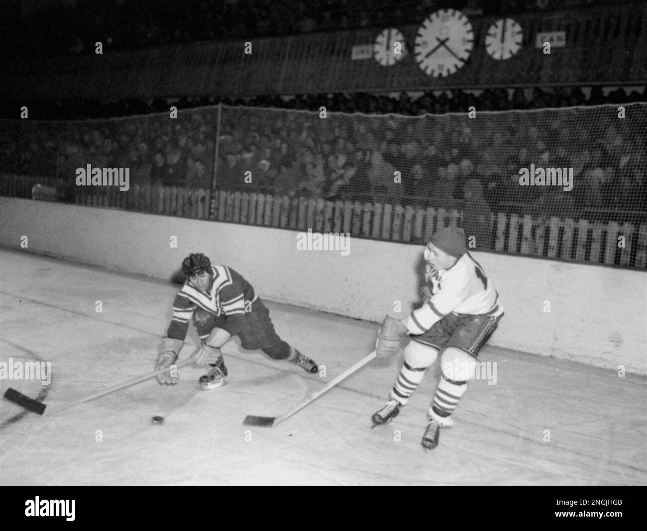 Russia's Ivan Tregubov, left, and Billy Colvin of Canada, reach for the ...