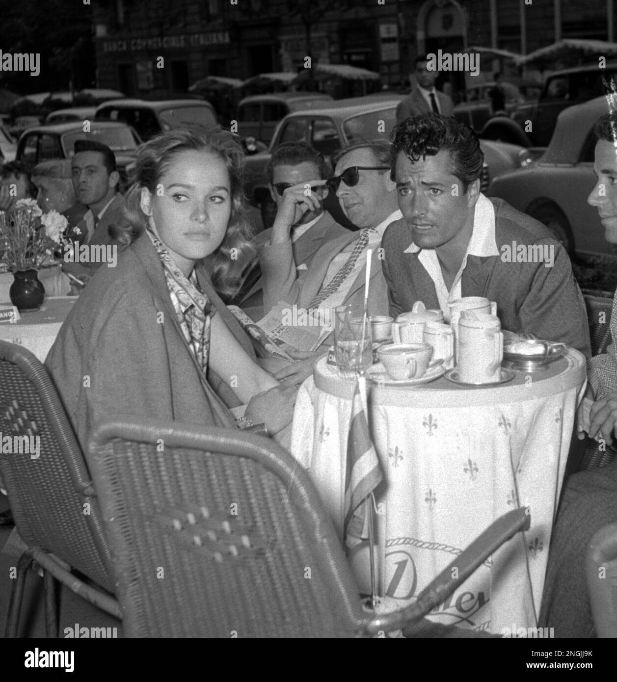 Movie actress Ursula Andress and her husband Hollywood actor, John Derek, chat while sitting at