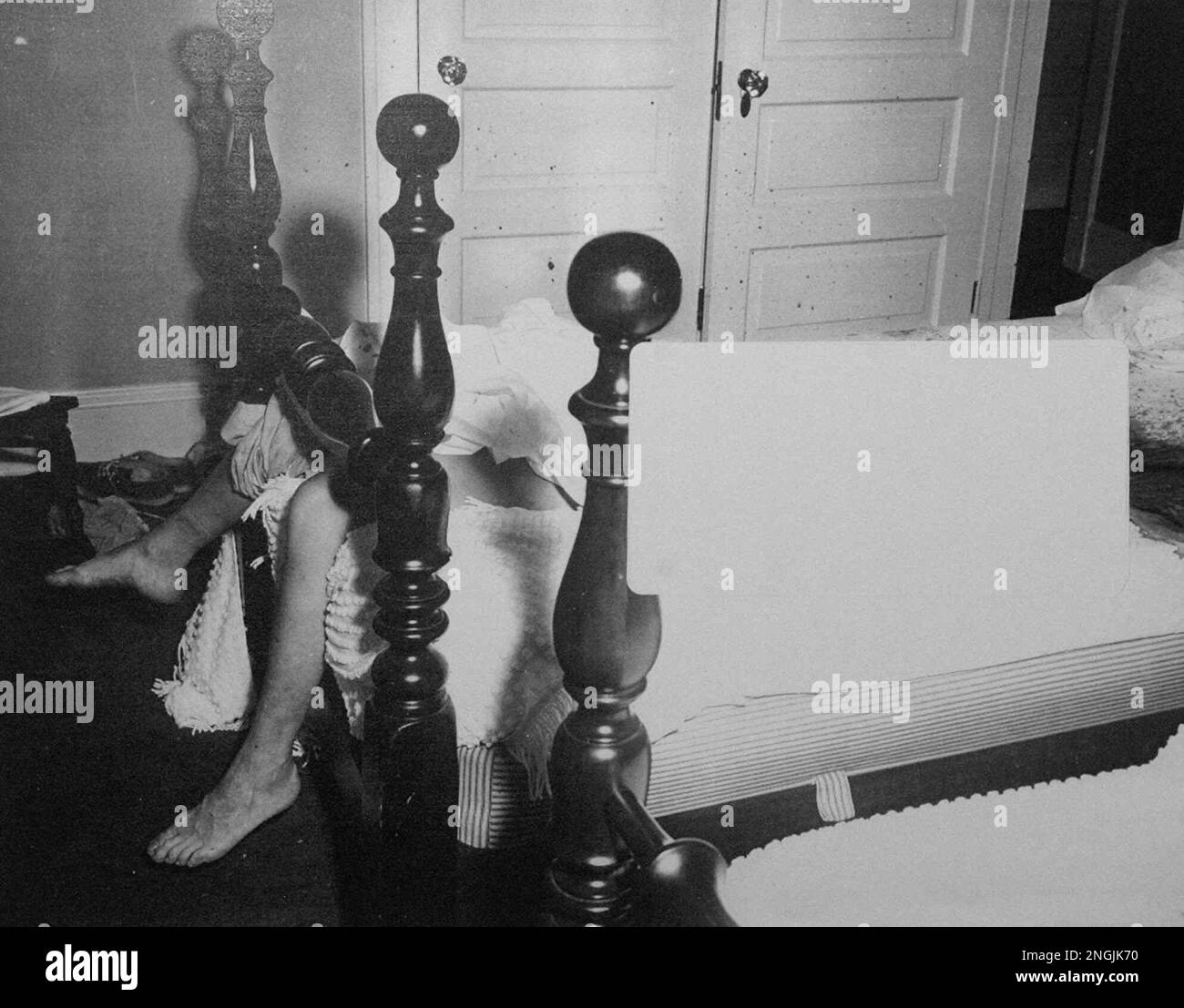 This is a 1954 police crime scene photo showing the body of Marilyn Sheppard after her murder. A white label covers the section of the photo showing Mrs. Sheppard's upper body. The photo was shown by an attorney for the estate of Dr. Sam Sheppard on Thursday, March 5, 1998, who claims that modern DNA testing of bloodstain evidence from 44 years ago, will clear Dr. Sheppard, who was originally found guilty of the murder. (AP Photo) Stock Photo