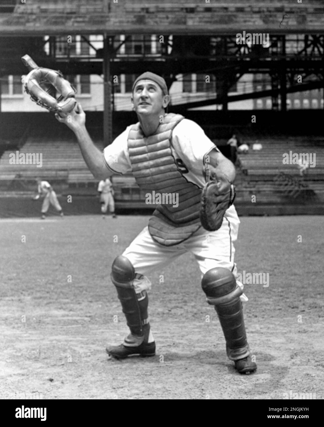 Cleveland Indian backstop, Alfonso Ramon Lopez, takes off his catcher's