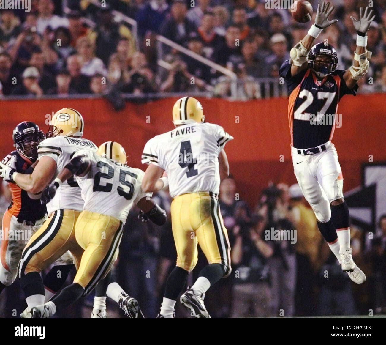 Denver Broncos safety Steve Atwater (27) jumps into the air in an