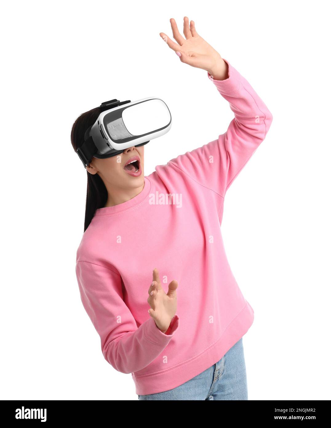 Woman using virtual reality headset on white background Stock Photo - Alamy