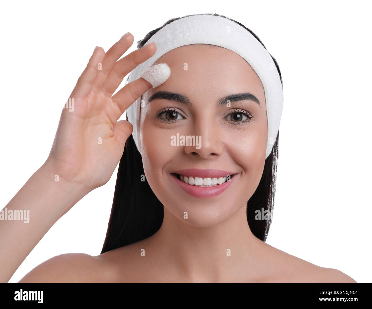 Woman using silkworm cocoon in skin care routine on white background ...
